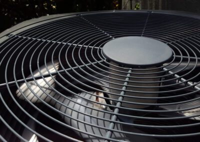 Air conditioner outdoor unit fan close-up.